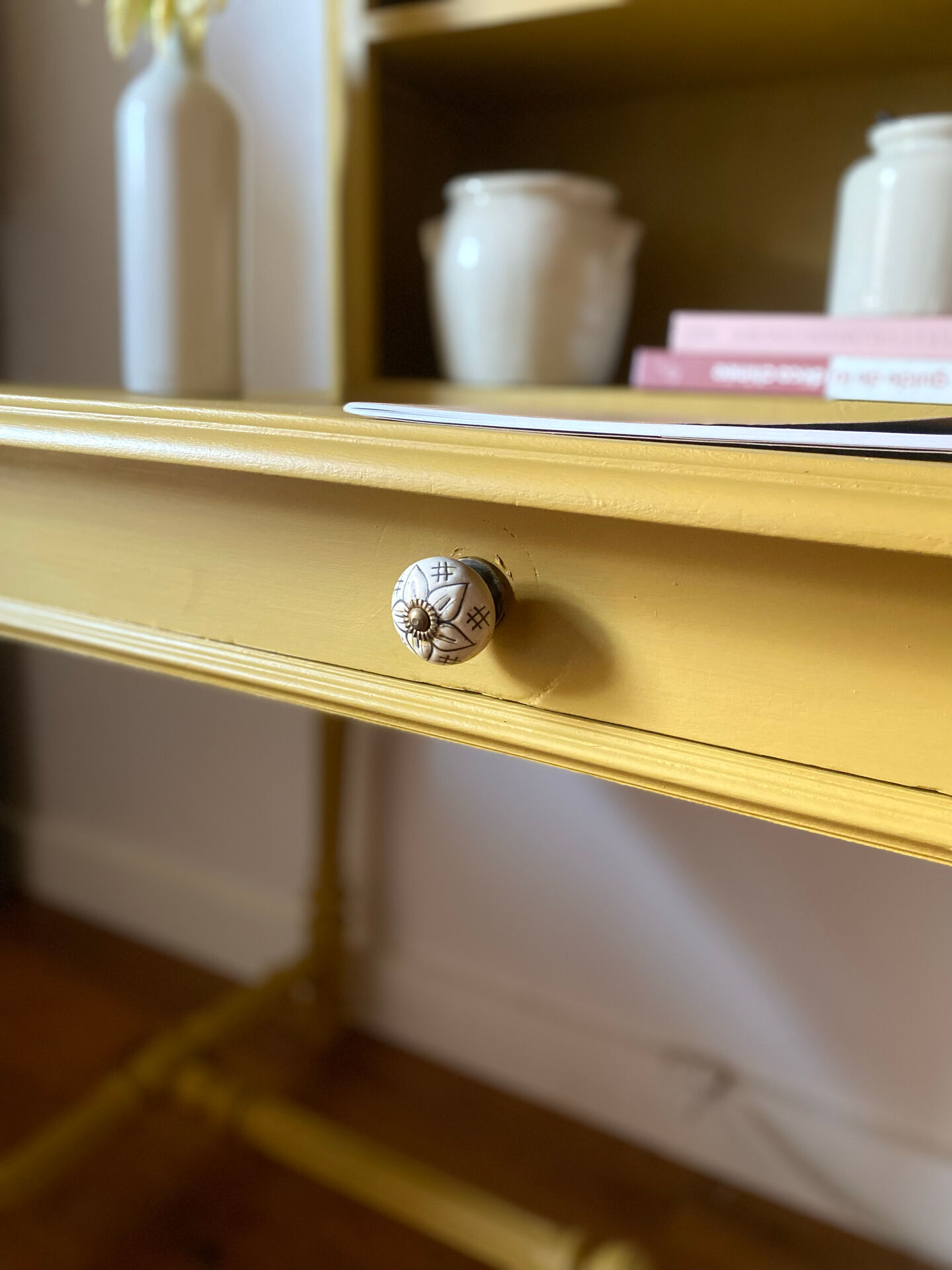 Desk table from the late 19th century, painted mustard, with turned stretcher.