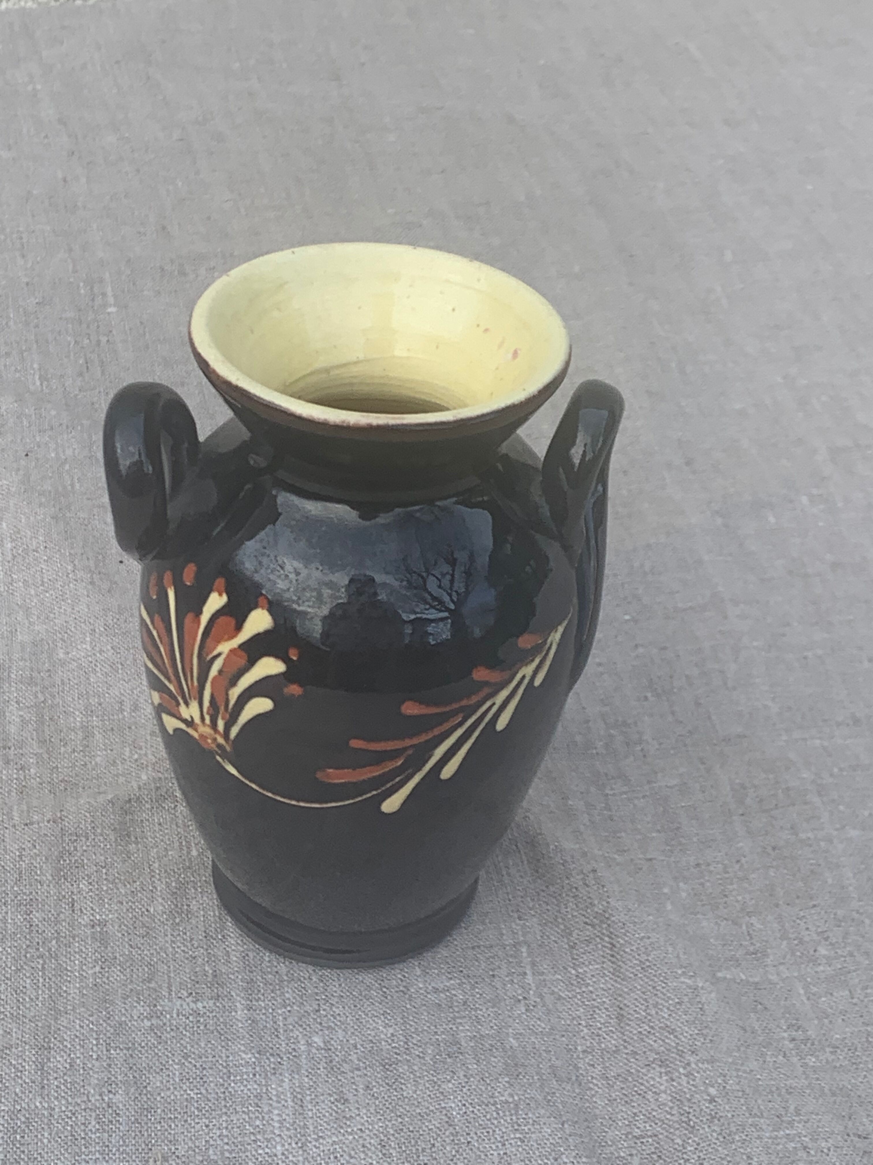Vintage hand-painted yellow and black glazed ceramic amphora vase