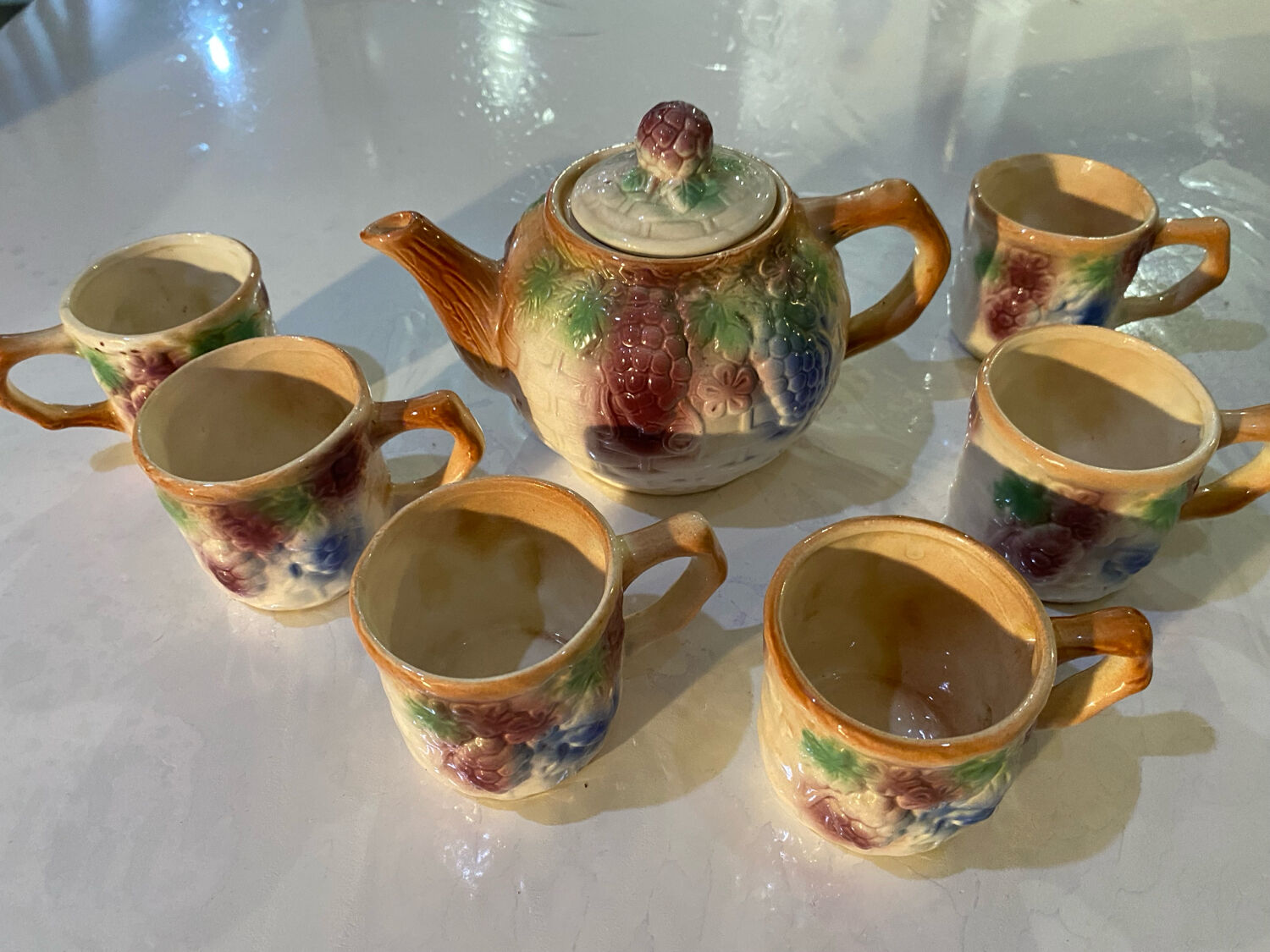 Vintage earthenware teapot and cup set