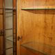 Vintage walnut burr buffet with glass and lighting, Art Deco style.