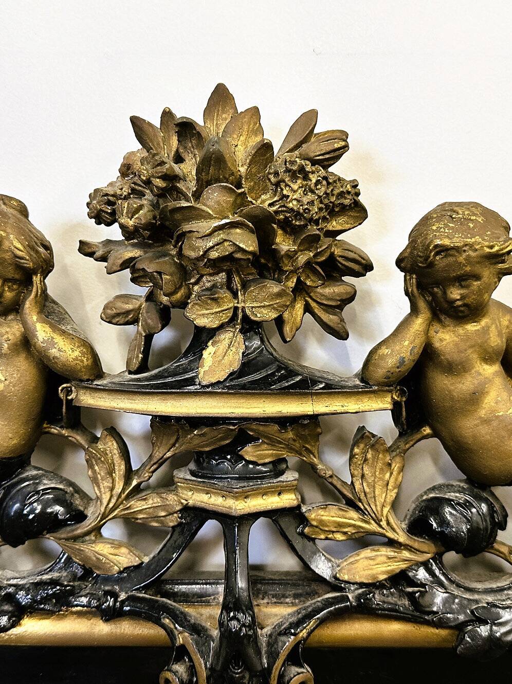 Antique 1800s black and gold mirror with cupid, France 1800s.