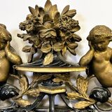 Antique 1800s black and gold mirror with cupid, France 1800s.