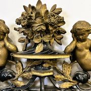 Antique 1800s black and gold mirror with cupid, France 1800s.