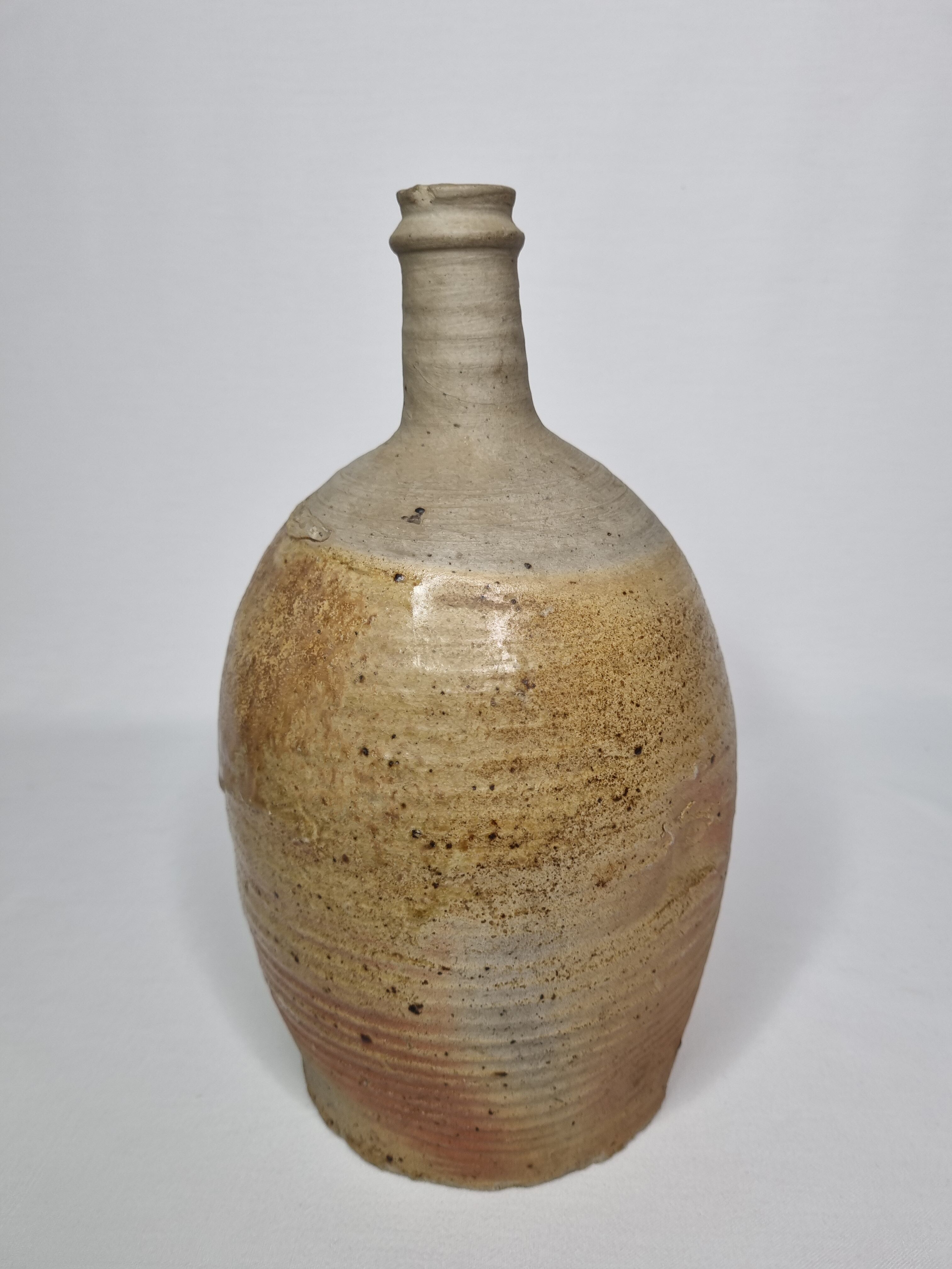 Set of three enamelled terracotta bottles