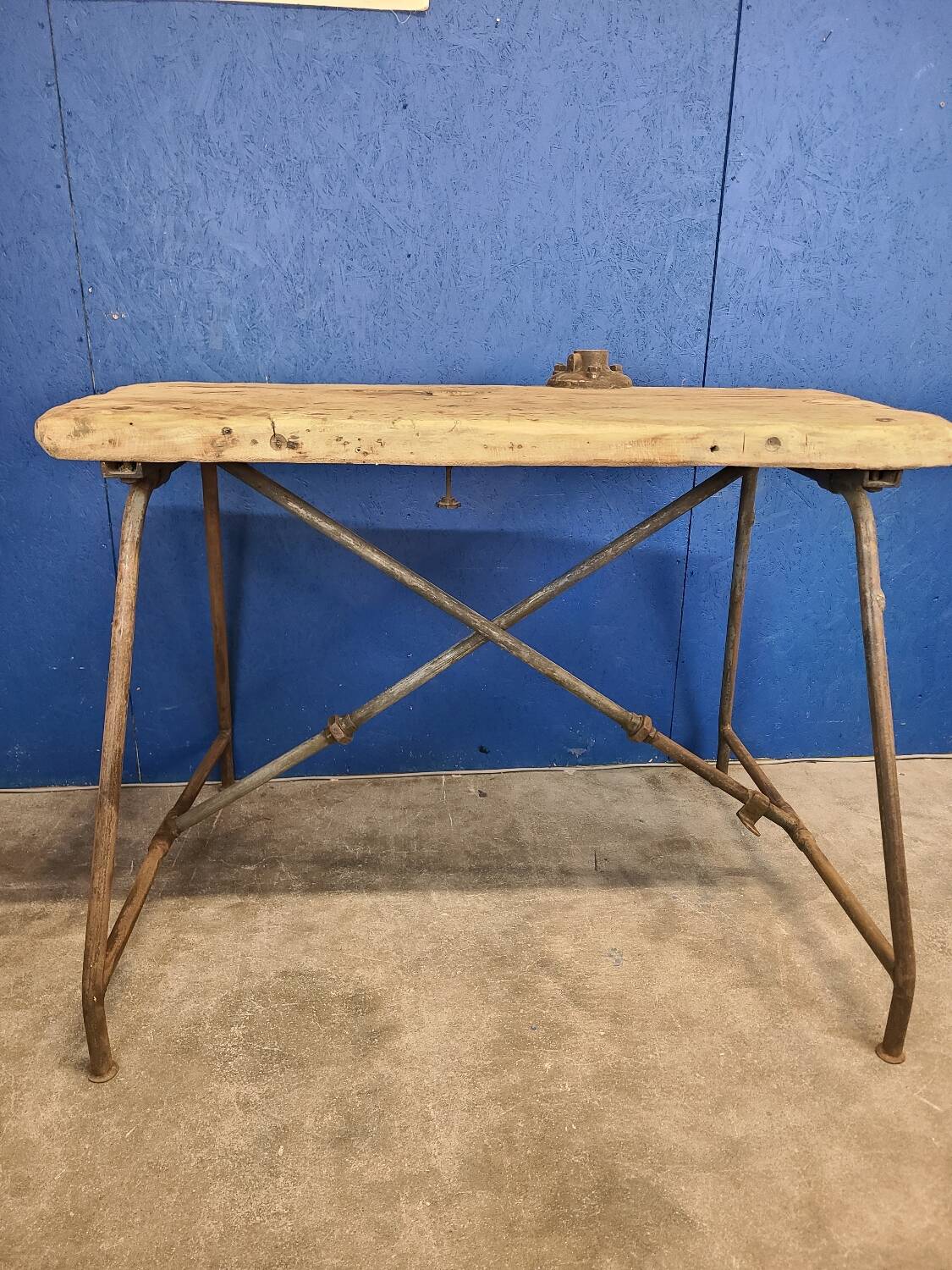 Vintage workbench circa 1930, folding metal leg.