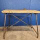 Vintage workbench circa 1930, folding metal leg.