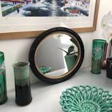 black and gold oval mirror