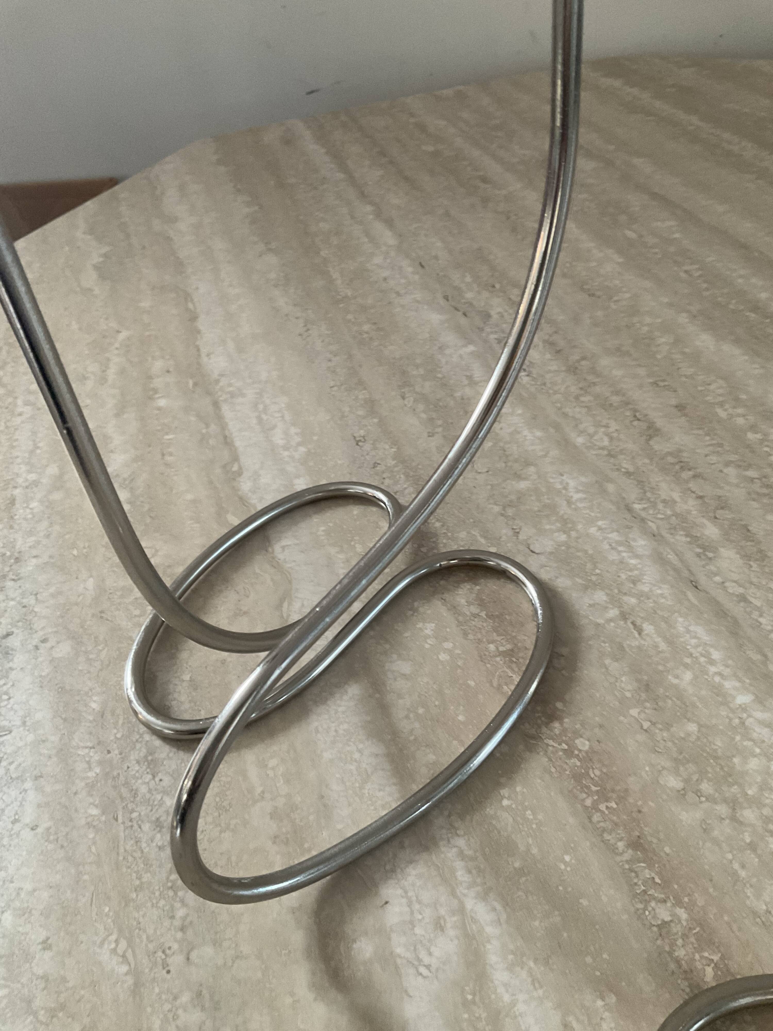 Pair of modernist silver metal candlesticks