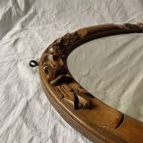 Antique oval beveled mirror in carved wood - 69 cm