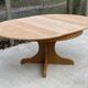 Round extendable Scandinavian dining table in Baumann style oak with central leg