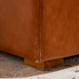 Ottoman with leather upholstery