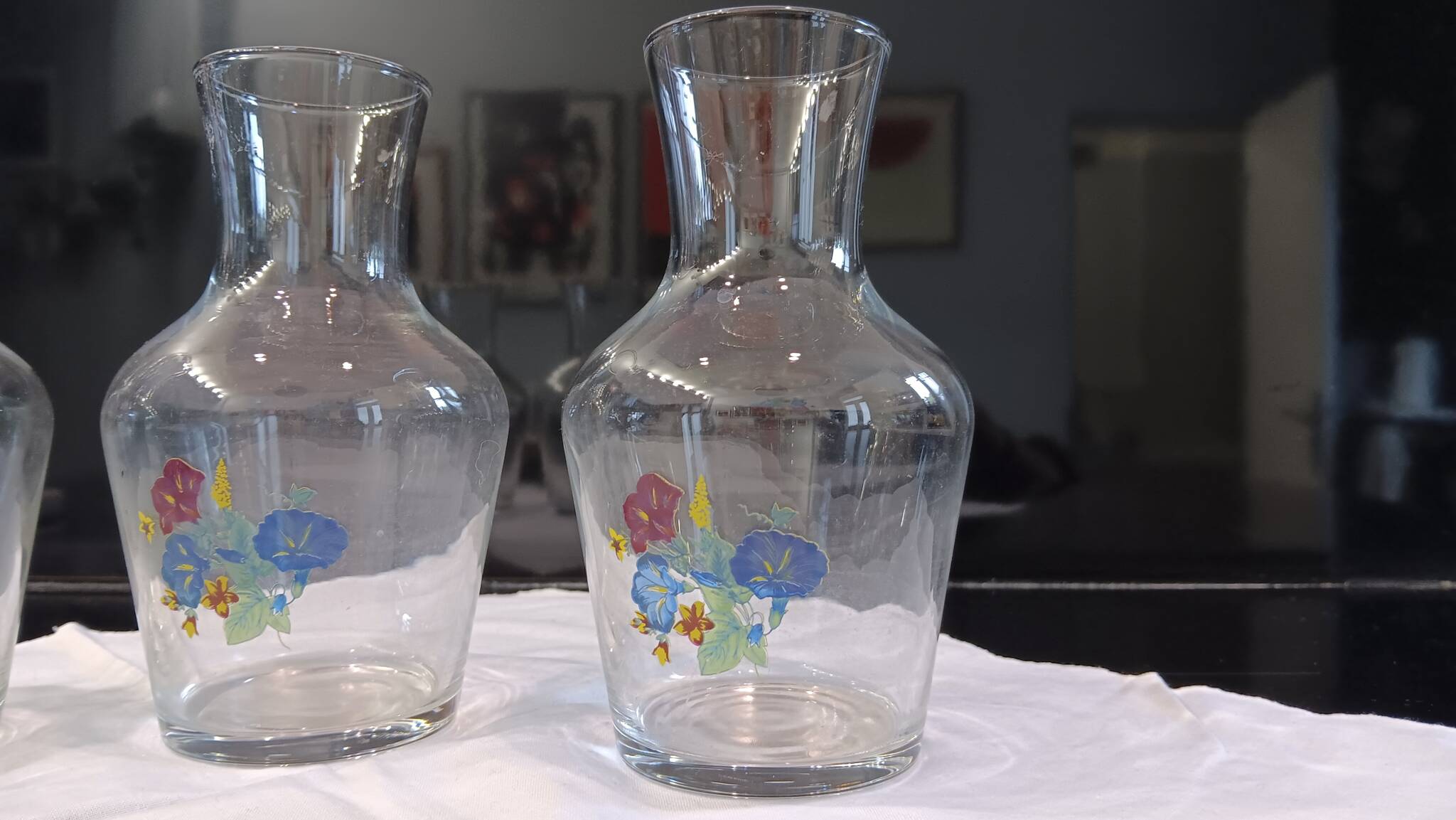 3 glass carafes, vintage. Very pretty floral pattern.