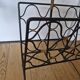 Porte revue fer forgé et rotin design attribué à Jacques Adnet