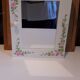 White mirrored toilet cabinet with floral pattern
