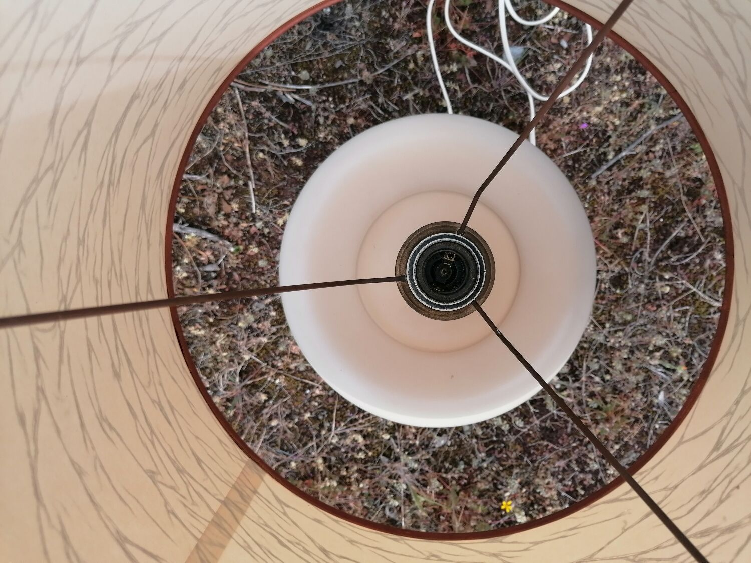 Vintage ceramic table lamp and golden lampshade.