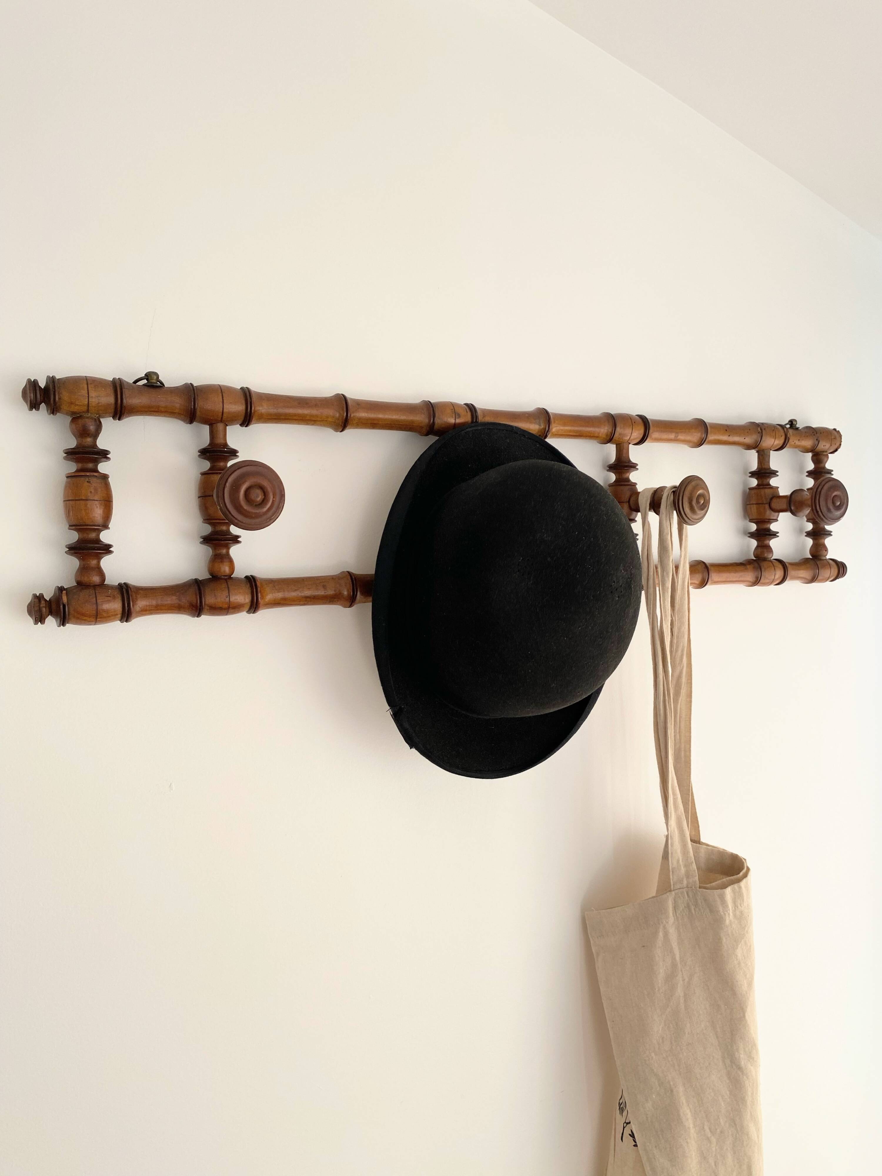 Vintage wooden wall coat rack with 4 swivel hooks from 1920