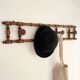 Vintage wooden wall coat rack with 4 swivel hooks from 1920