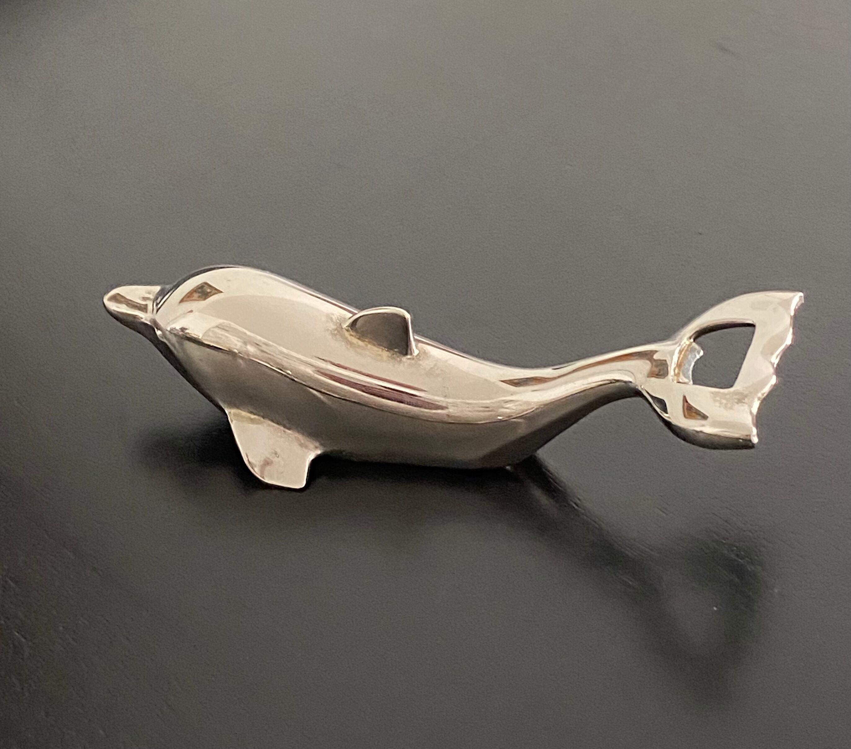 Bottle opener dolphin shape