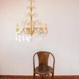 Large golden Italian chandelier with white opaline drops.
