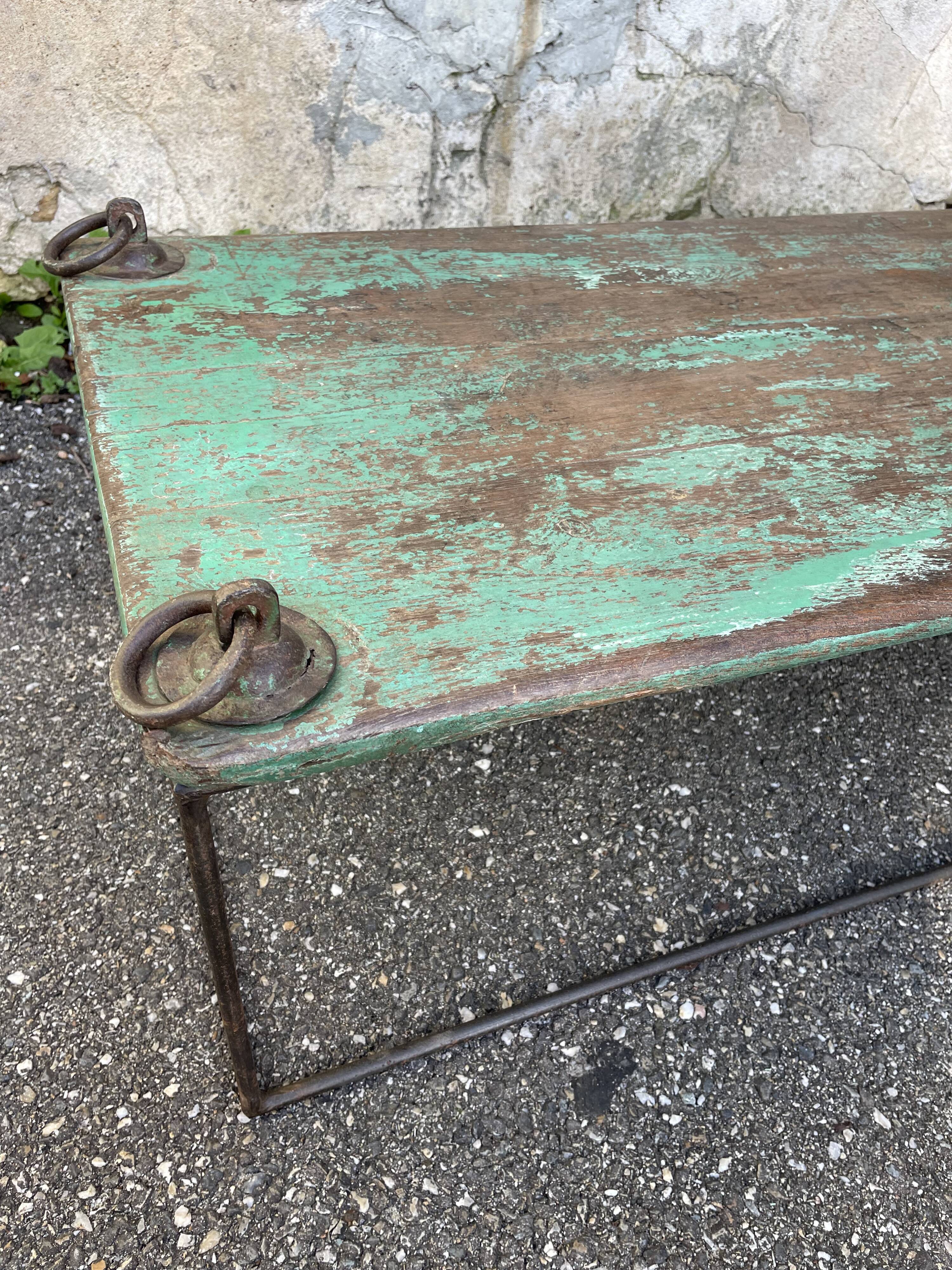 Pair of green teak coffee tables.