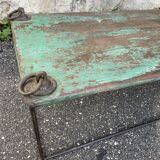 Pair of green teak coffee tables.