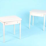Pair of white lacquered bedside tables