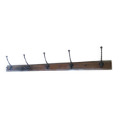 Antique coat rack made of wood and cast iron.