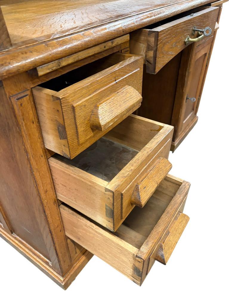 Vintage American desk made of solid wood with a curtain.
