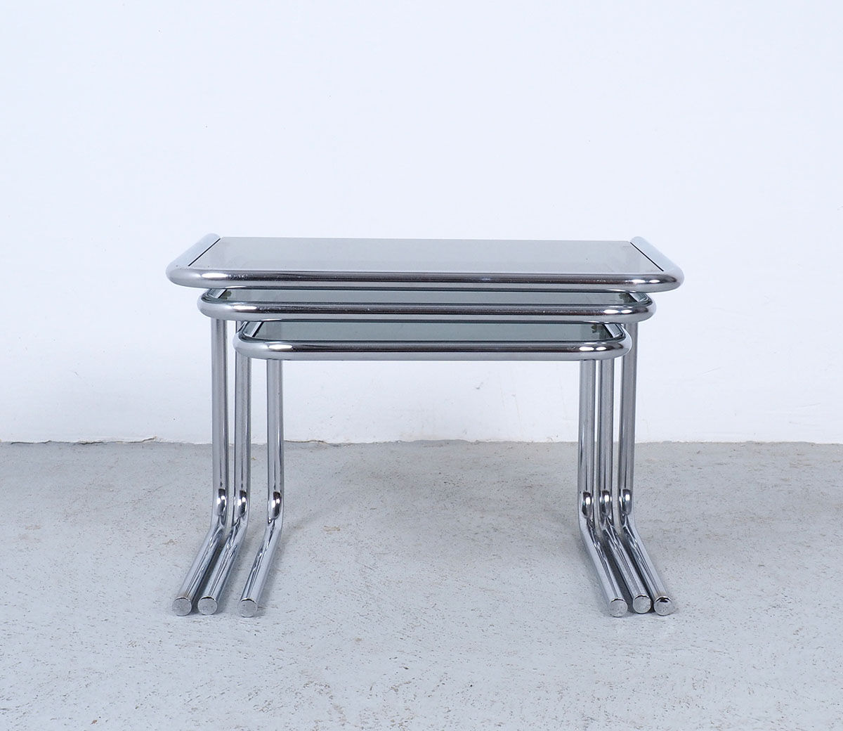 Vintage chromed nesting tables with smoked glass