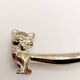 12 vintage silver metal cat knot knife rests