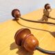 Pair of antique wooden and metal coat hooks
