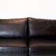Two seater sofa upholstered with black leather and of danish design