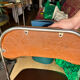 Brown folding chair in vinyl and steel