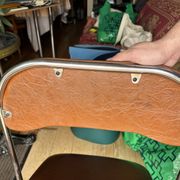 Brown folding chair in vinyl and steel