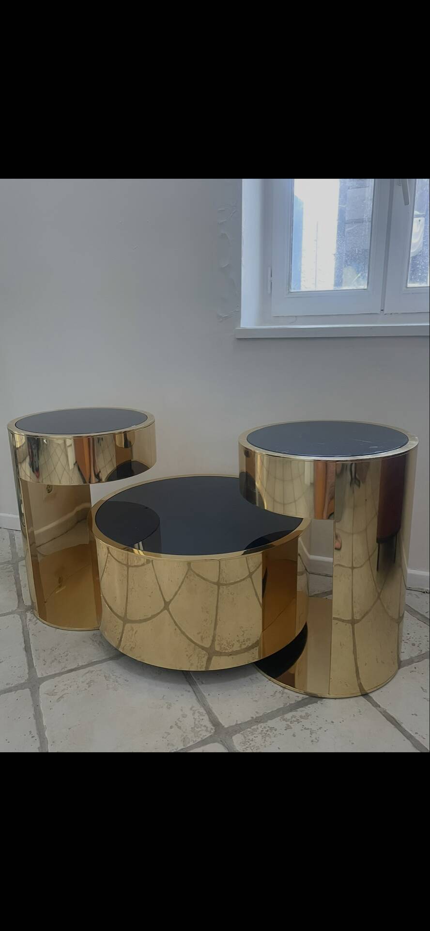 2 bedside tables and a brass Fendi table.