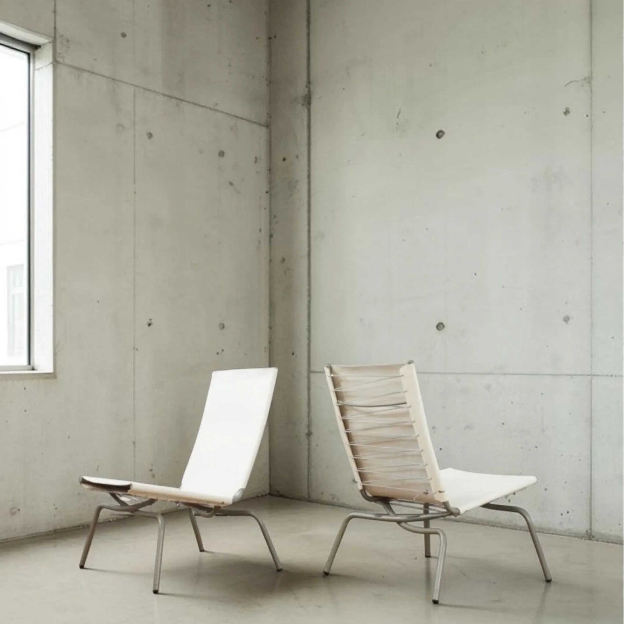 Set of 2 Crossed Legged lounge chairs by Fabiaan van Severen.
