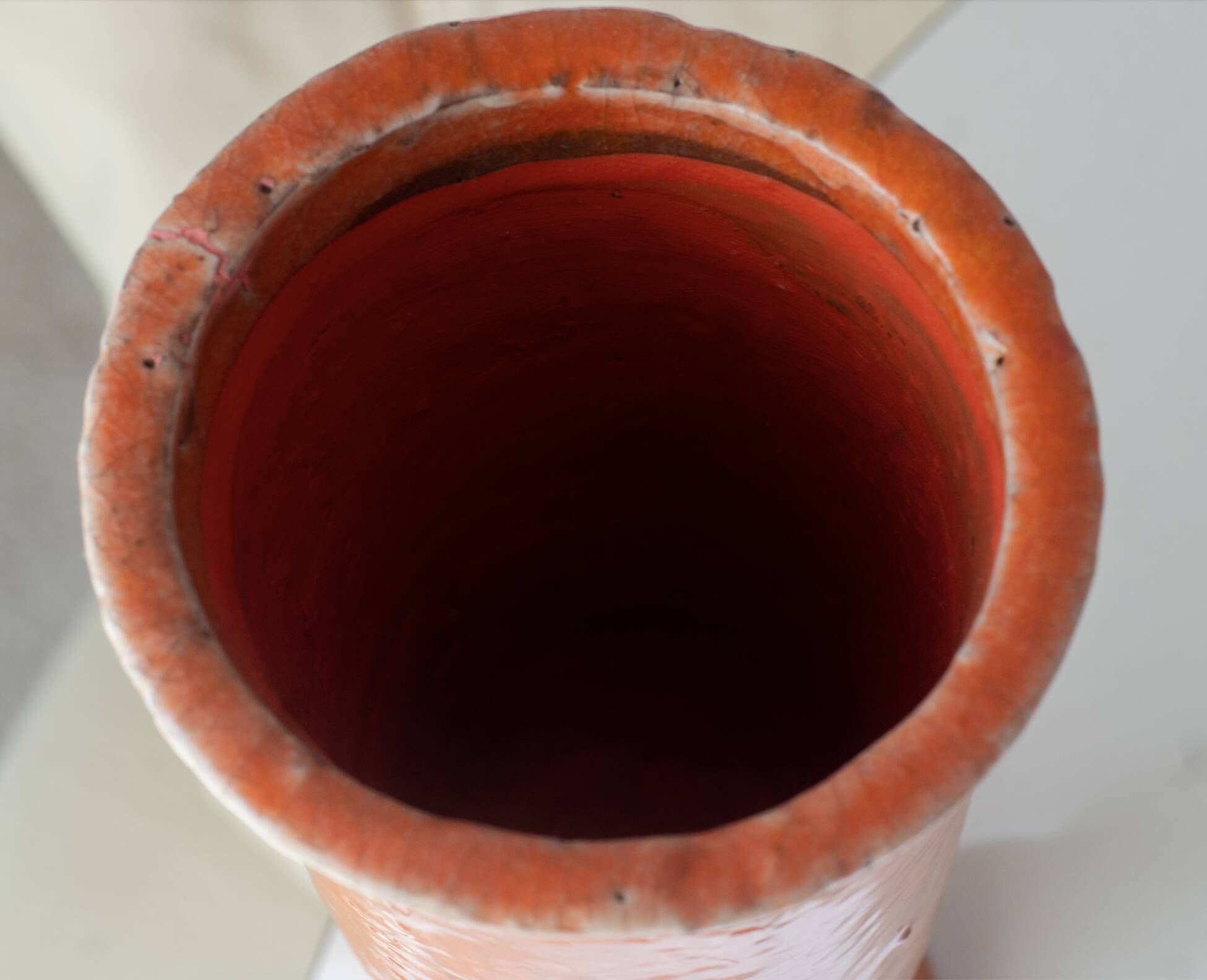 Orange glazed terracotta vase