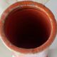 Orange glazed terracotta vase
