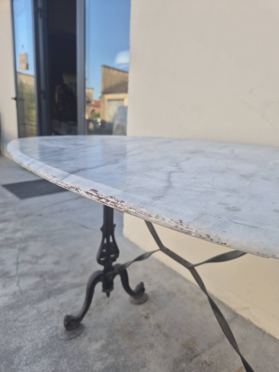 Antique cast iron and marble bistro restaurant table