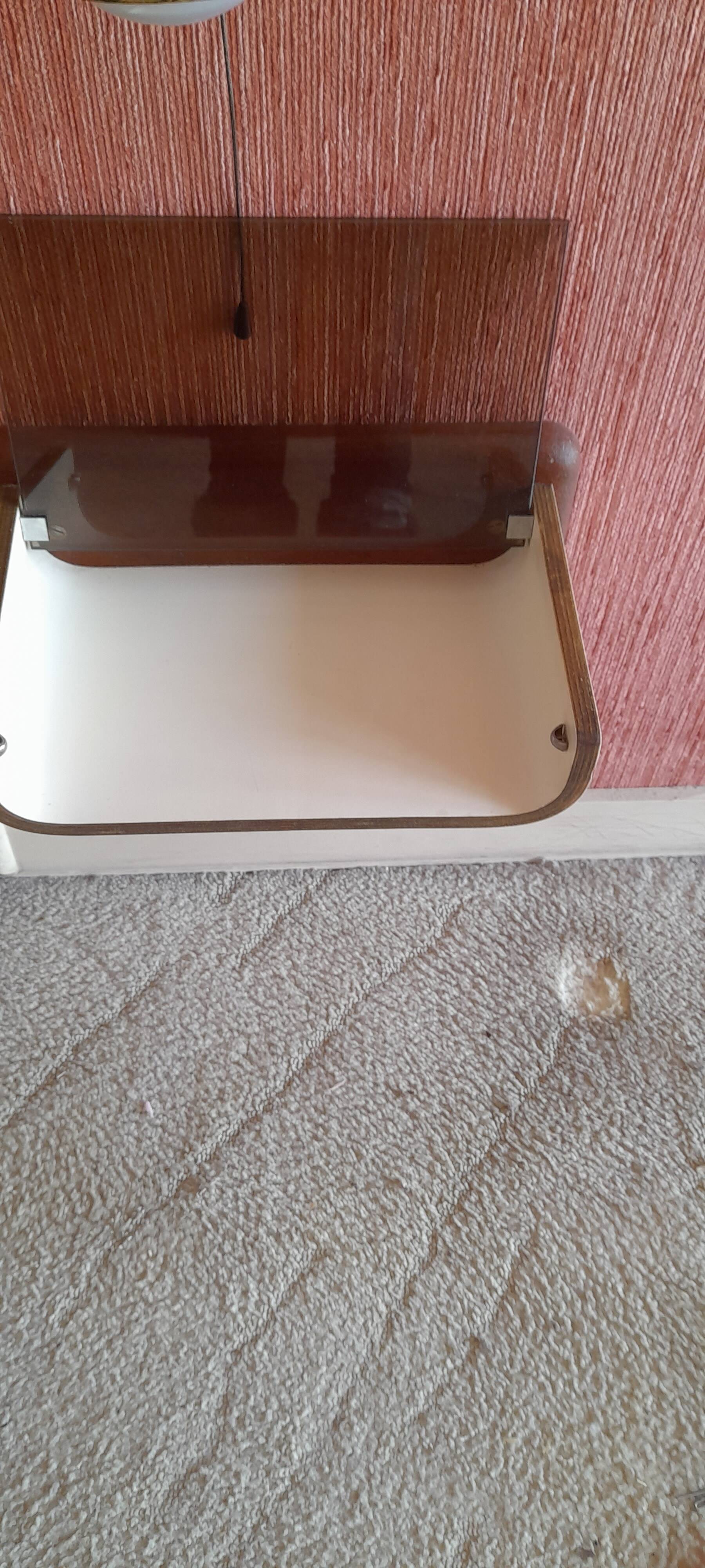 Pair of wooden bedside tables with smoked glass tops from the 1970s.