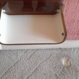 Pair of wooden bedside tables with smoked glass tops from the 1970s.