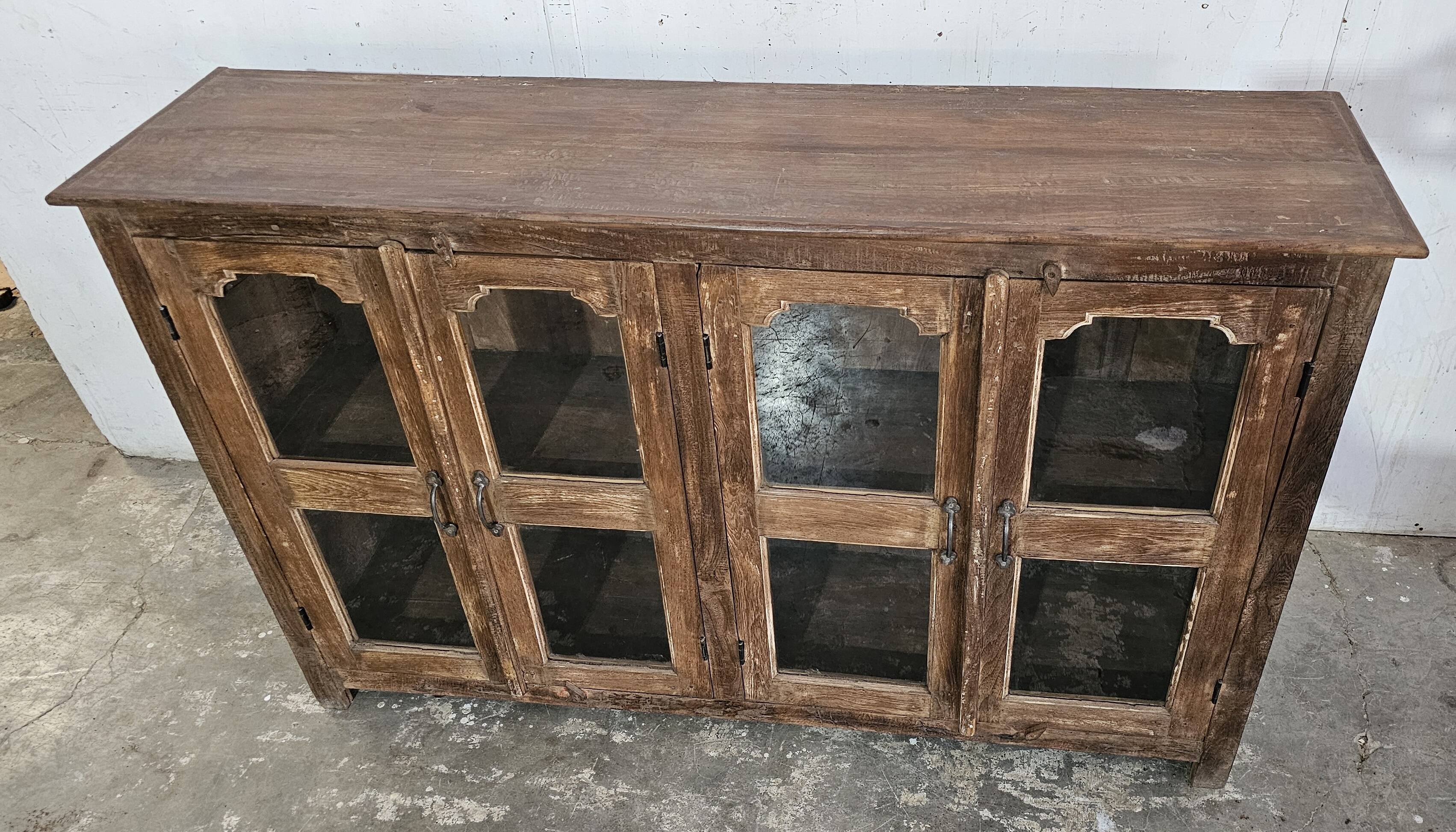 Antique glass-fronted buffet in Burmese teak