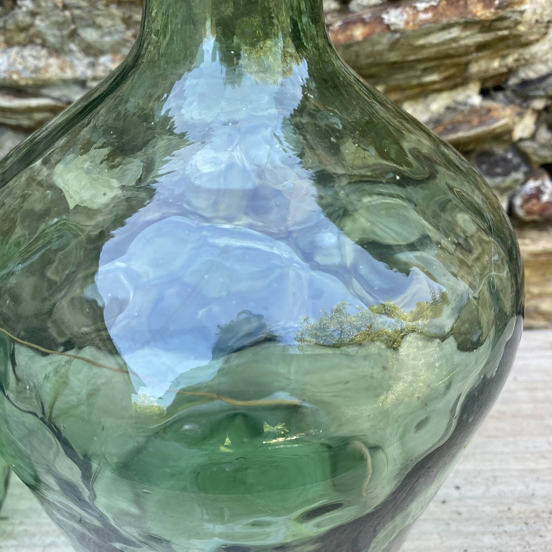 set of tinted glass demijohns