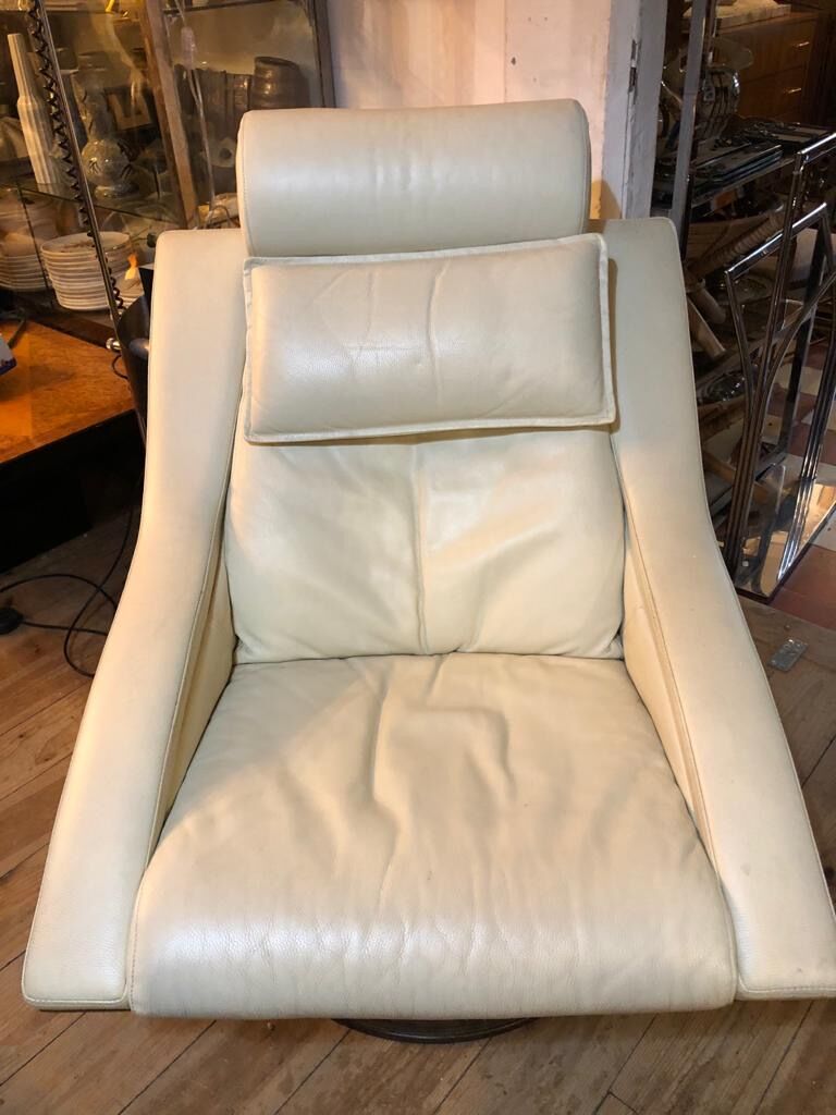 White leather armchair and ottoman