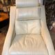 White leather armchair and ottoman