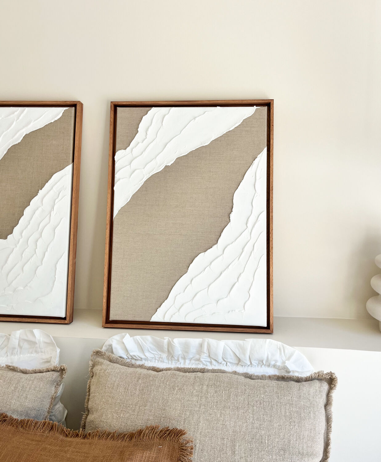 Diptych relief panels in linen and white.