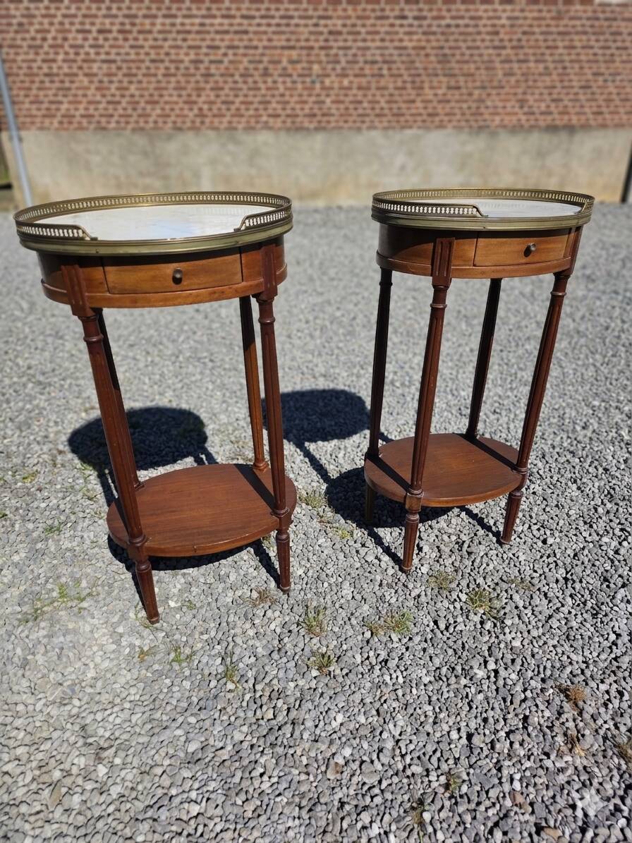 Pair of Louis XVI style bedside tables in mahogany, with marble tops.