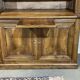 Library in walnut and oak from the early 20th century with its central clock.