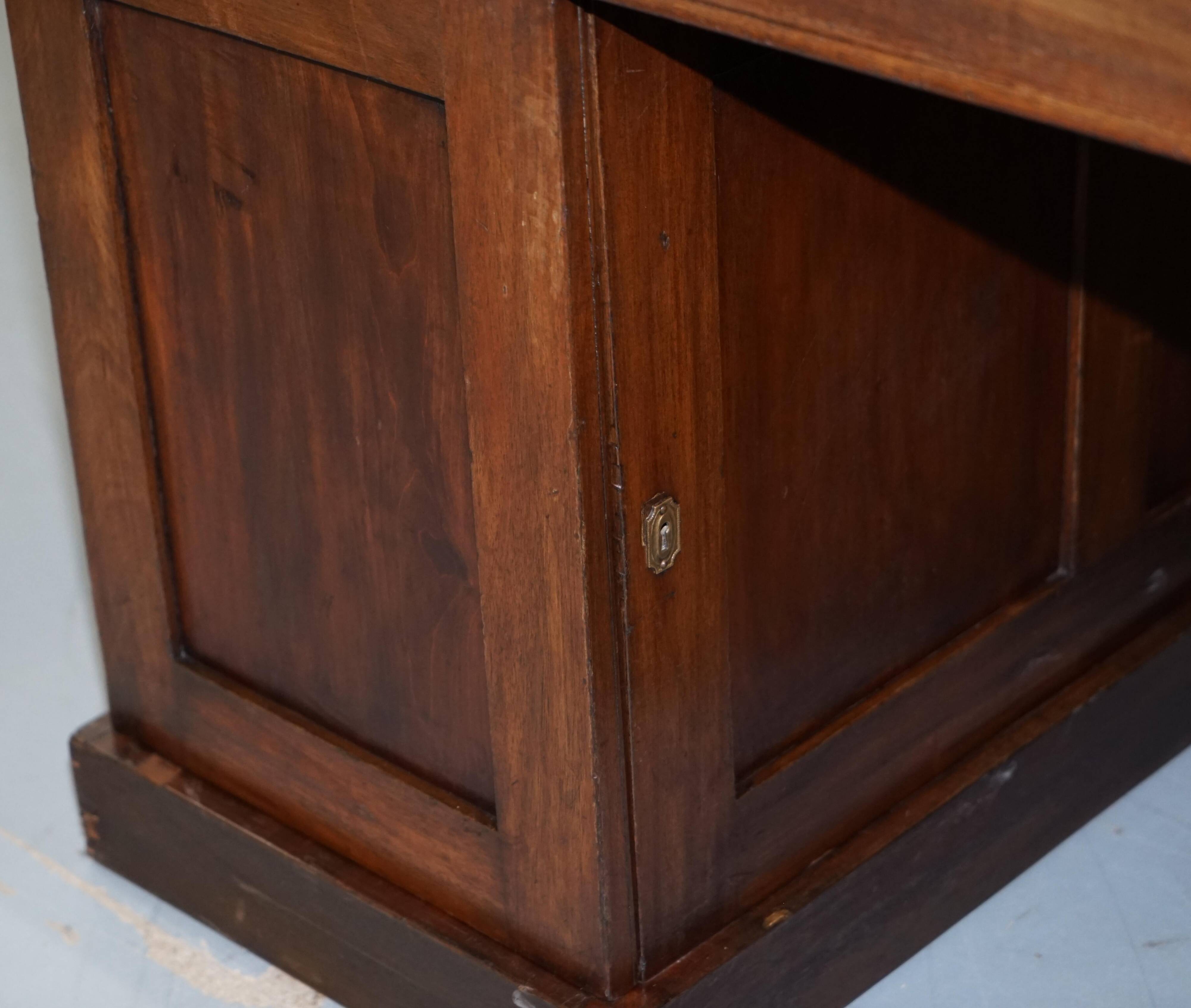 George III double-sided partner's desk in walnut circa 1780 with original handles.