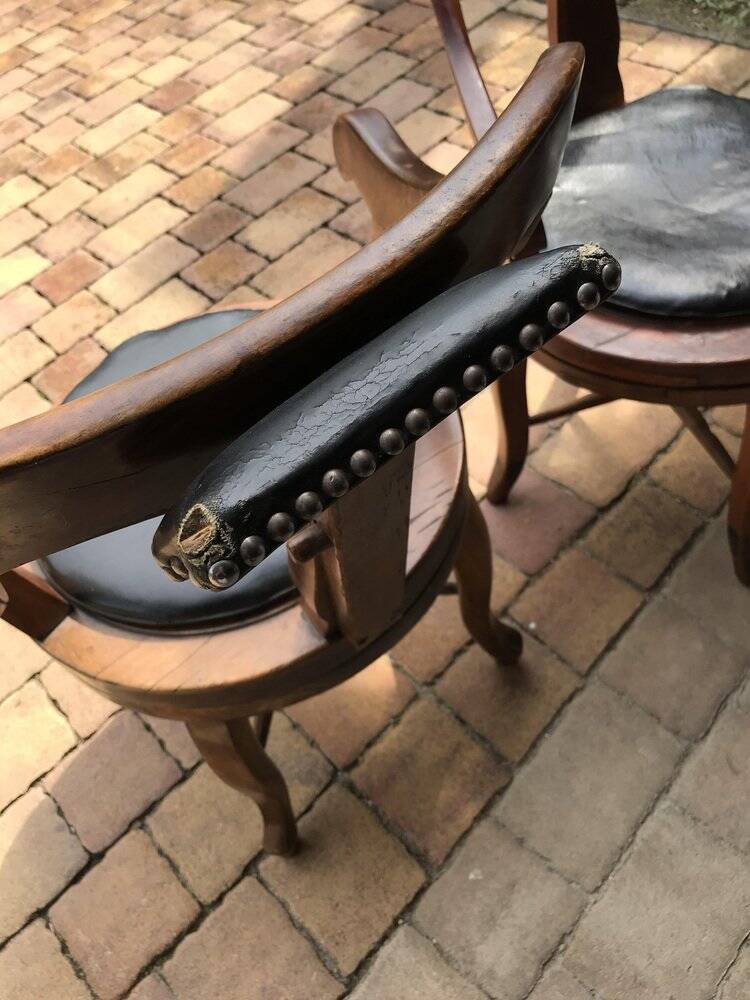 Pair of antique brown swivel armchairs in upholstery fabric, wooden frame, Hungary circa 1900.